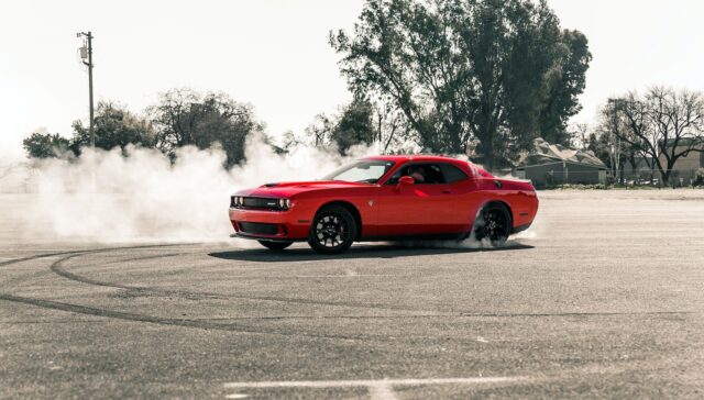 Red Coupe Drifting on Asphalt Road