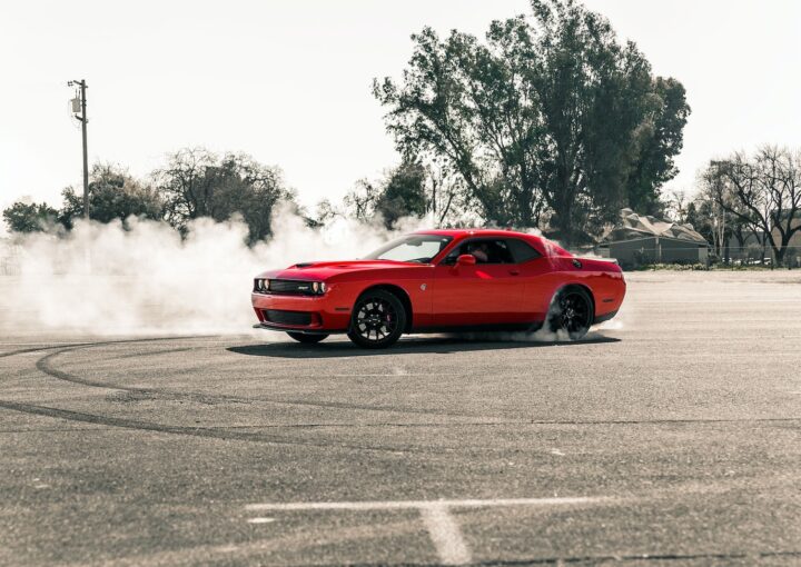 Red Coupe Drifting on Asphalt Road